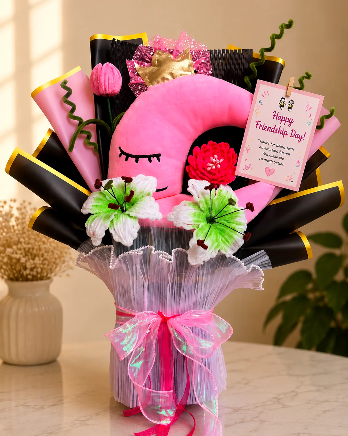handmade pipe-cleaner flower bouquet built around a plush moon, threaded with fairy lights