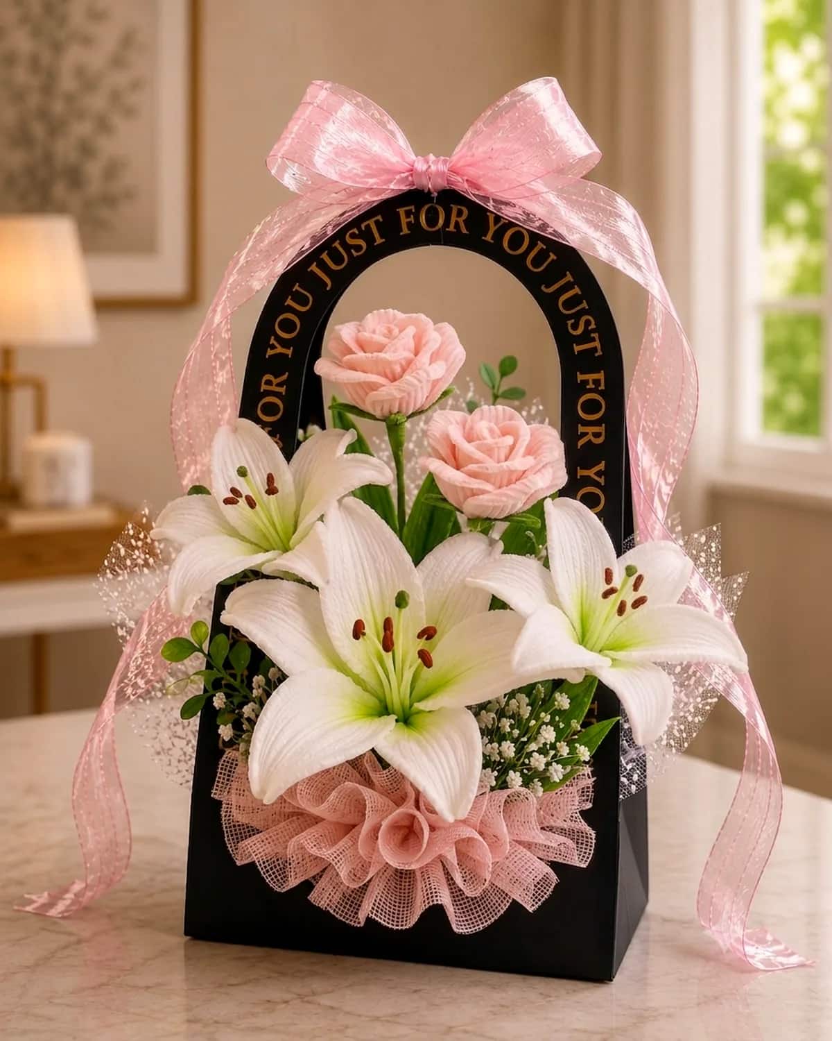 handmade pipe-cleaner flowers standing in an arched gift bag with a ribbon bow