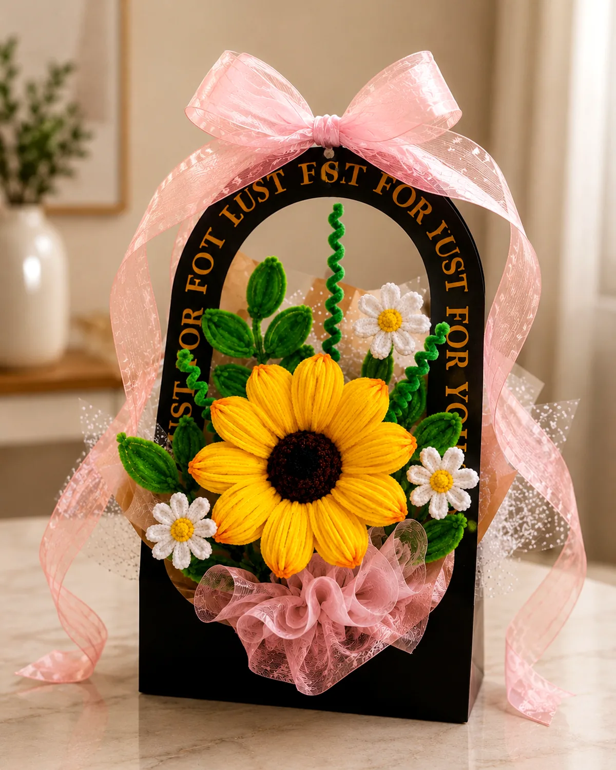 handmade pipe-cleaner flowers standing in an arched gift bag with a ribbon bow — sunflowers + daisies, view 2