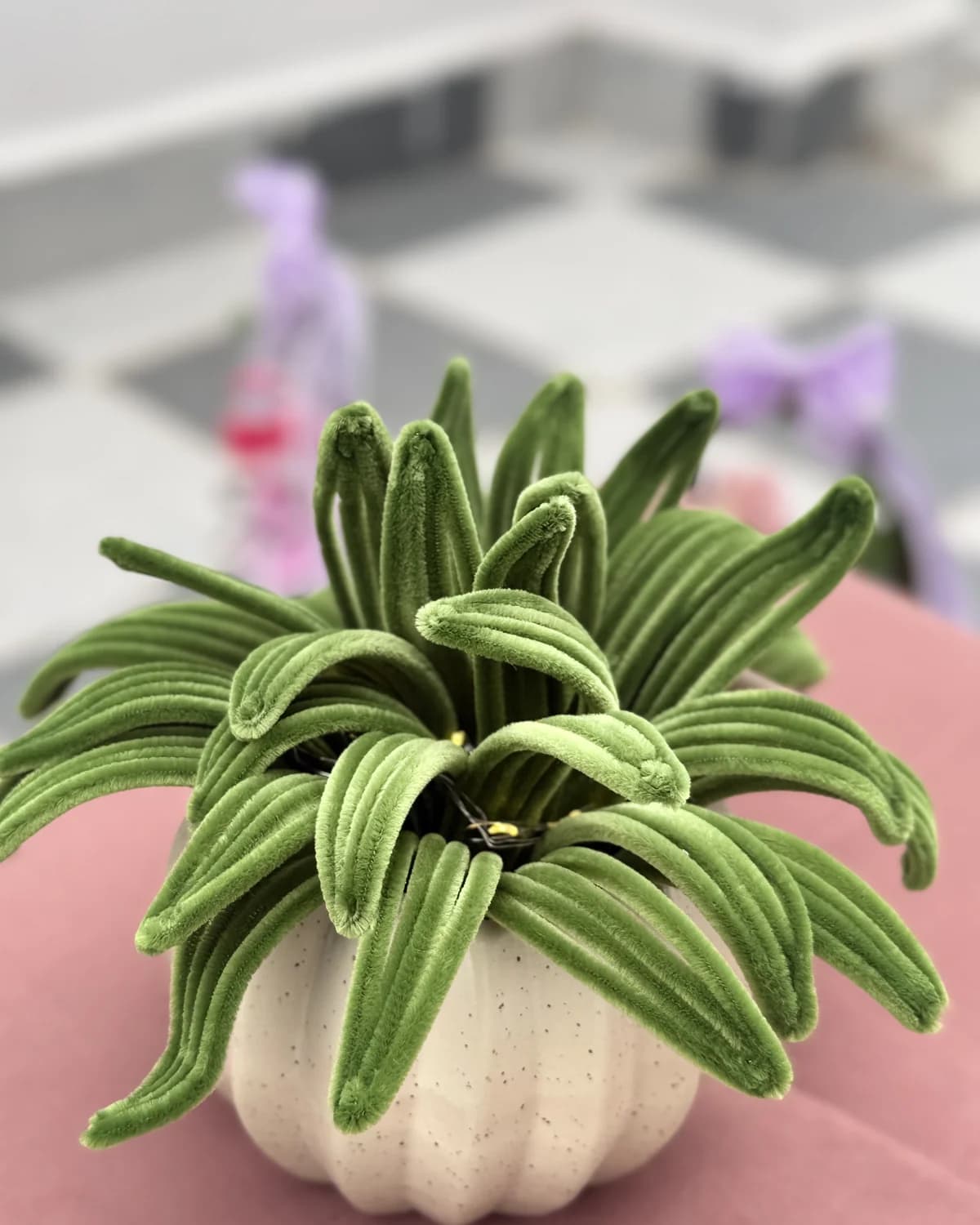 handmade chenille spider plant with long green leaves, planted in a cream ceramic pumpkin pot, view 2