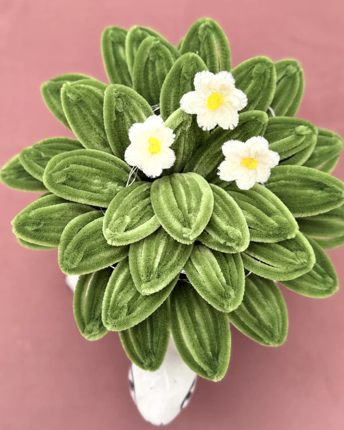 handmade chenille succulent with small white flowers, planted in a white ceramic turtle pot, view 3
