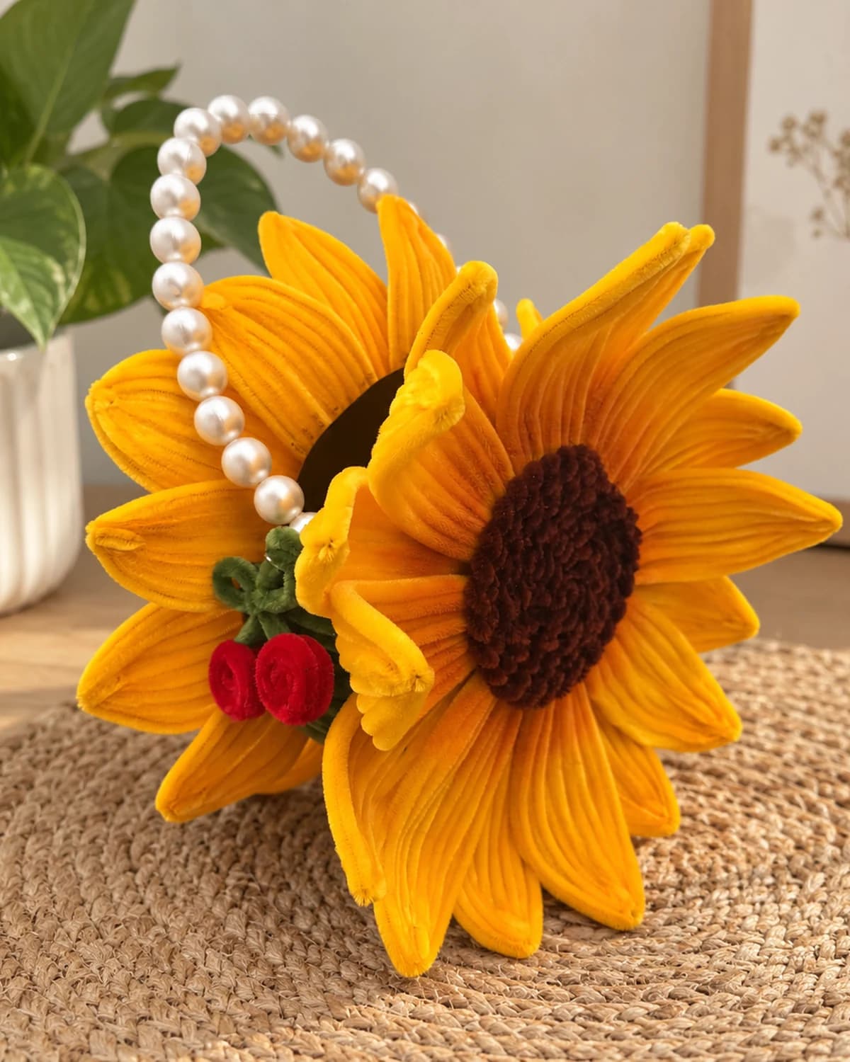 handmade chenille sunflower handbag with a pearl bead top handle, a second bloom, and two red chenille cherries on a green stem — a flower-shaped purse for a mehendi or wedding function, view 3